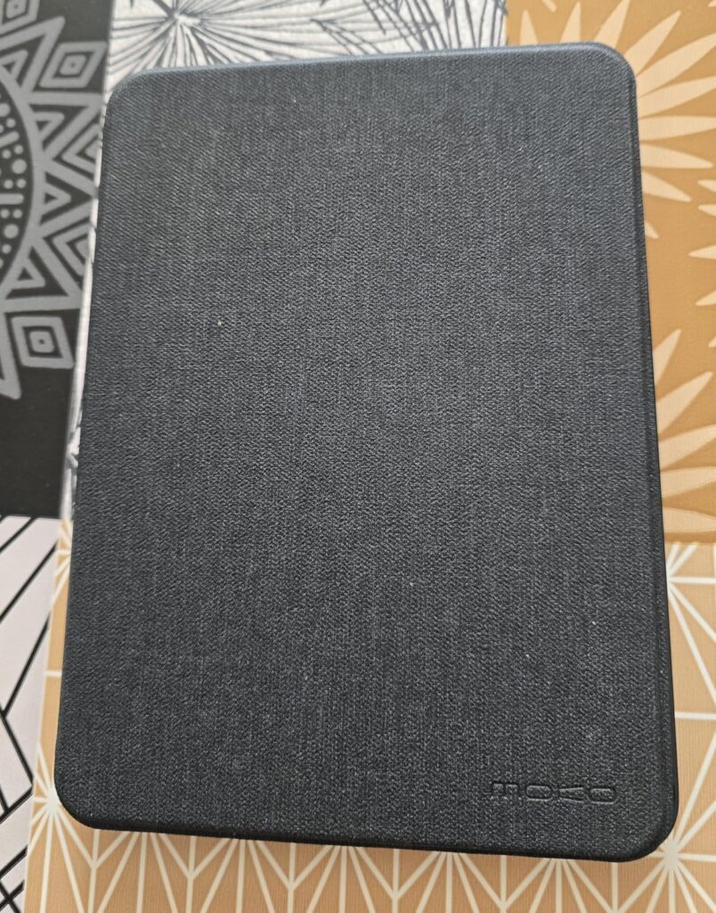 Liseuse fermée, vue de dessus, couverture gris anthracite.